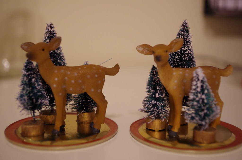 At this point, you're totally impatient and really want to get this snow globe assembled. Tell your horses to hold their festive selves -- you are about to put these things in water and if you don't let the glue dry, it's going to be a bad scene. Let the jar lids dry overnight.  You can take this time to make other holiday crafts, like yarn-covered-styrofoam-form-Christmas trees or voodoo dolls of all of the relatives who will soon ask you embarrassing and relentless questions about why you're not married.